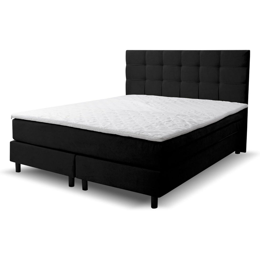 Weiche Polster praegen die Gestaltung von dem Boxspringbett