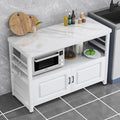 Ein Metallgestell an dem Sideboard in Weiss